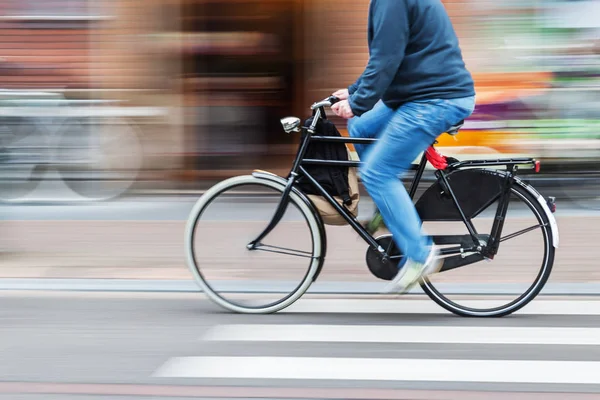 Bicycle rider in motion blur — Stock Photo, Image
