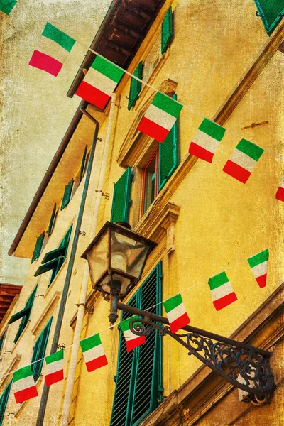 Vintage style picture of an Italian house with flags — стоковое фото