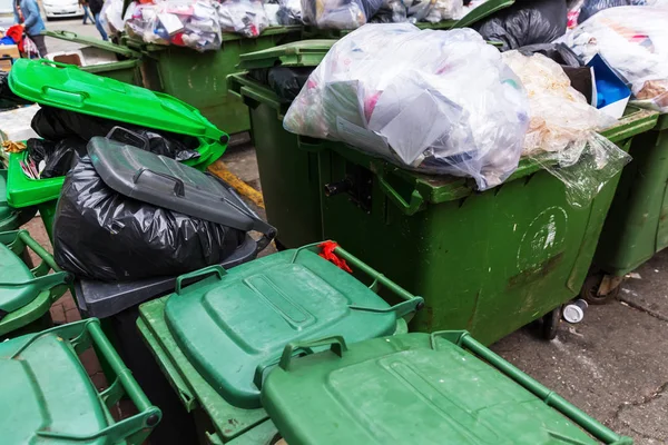 Lot of filled green waste containers — Stock Photo, Image