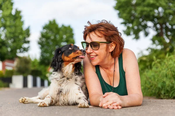 Portrait of a mature woman with Brittany dog — Stock Photo, Image