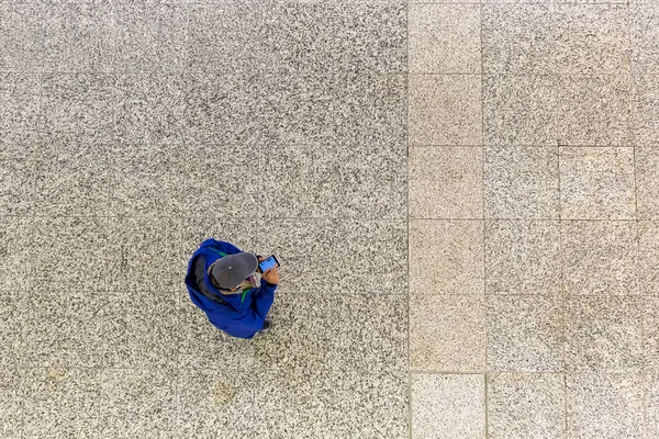 Man with phone seen from above — Stock Photo, Image