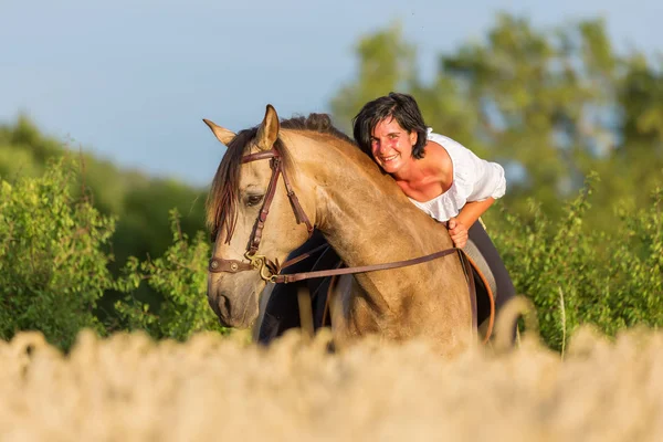 Portrait of a woman on an Andalusian horse — Stock Photo, Image