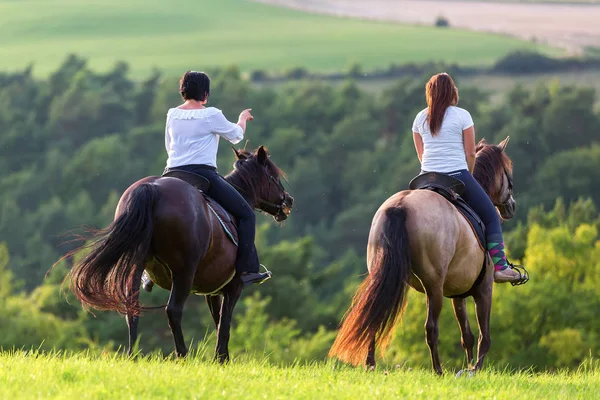 Two women ride Andalusian horses — Stock Photo, Image