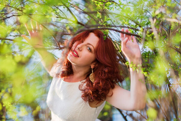 woman posing in a spring bush