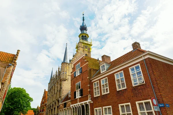historic houses with the steeple of the historic town hall in Veere, Netherlands
