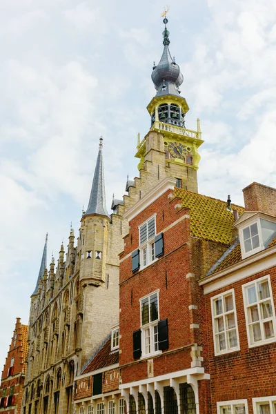 historic houses with the steeple of the historic town hall in Veere, Netherlands