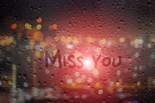 Draw miss you on window at night background — Stock Photo, Image