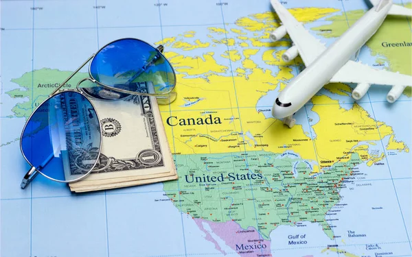 travel concept with plan money passport sunglasses