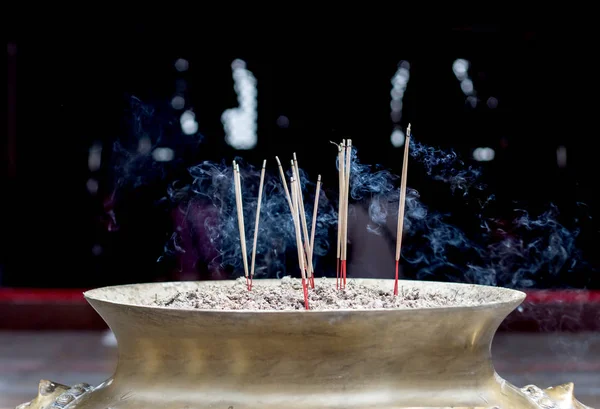 burning incense on sand box