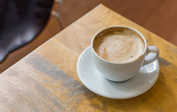 Latte art coffee on wood table — Stok Foto