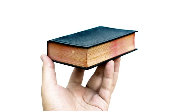 Mão segurar minilivro bíblia — Fotografia de Stock