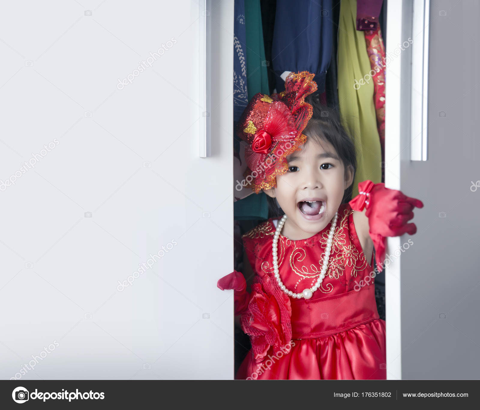Asian Girl Dress Up In Wardrobe Stock Photo C Yanukit 176351802