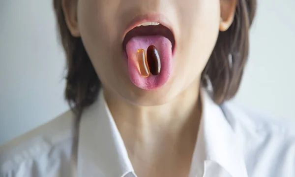 Asian woman take herb green pill for healthy — Stock Photo, Image