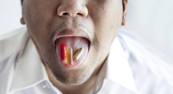 open mouth to eat pill and capsule