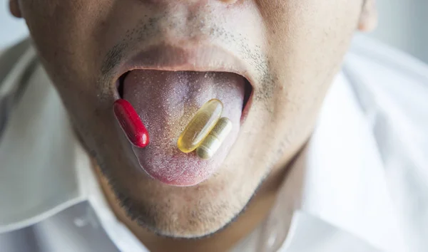 open mouth to eat pill and capsule