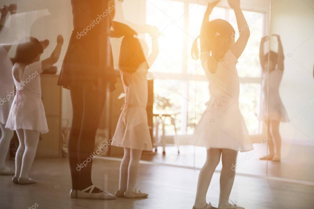 kid practice ballet dancing