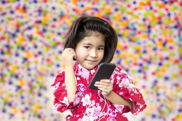 asian girl smile with earphone and mobile phone