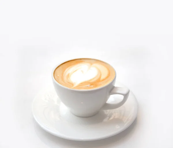 Late art on white ceramic coffee cup on white — 스톡 사진