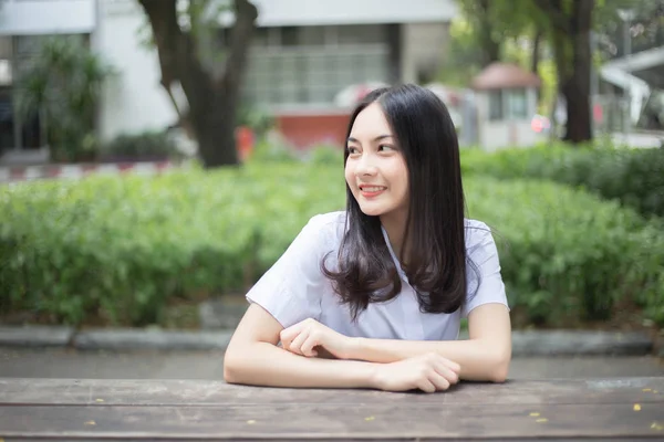 Sharming teenage asian girl smiling on university student unifor — Stock Photo, Image