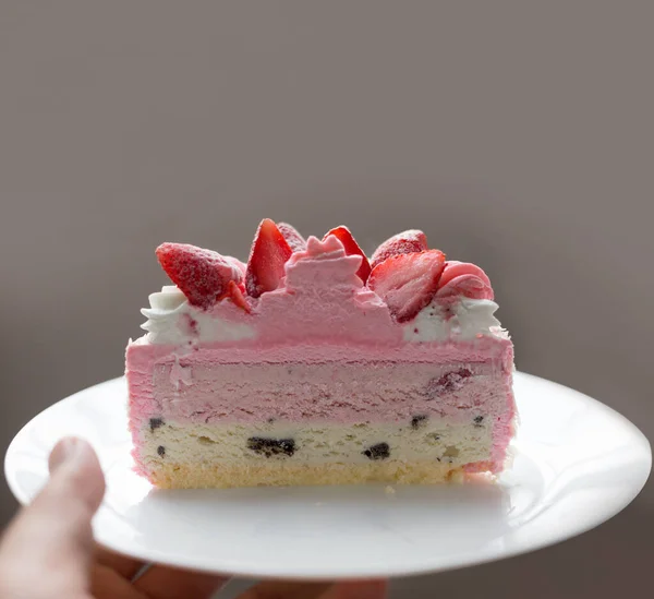 serve strawberry cheese cake and ice-cream on blurry background