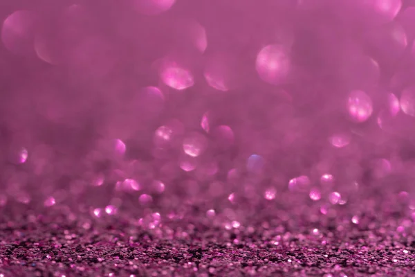 Parıltı, ışıltı çözünmüş bulanık mor mor arkaplan ve bokeh ışıkları