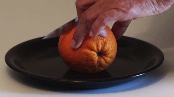 Woman Hand Cutting Orange White Background Black Plate — Stock Video