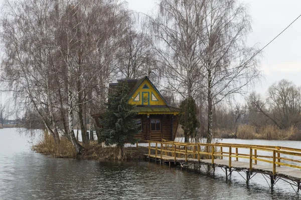 Fairy  fisherman's  hut on the lake — Stock Photo, Image