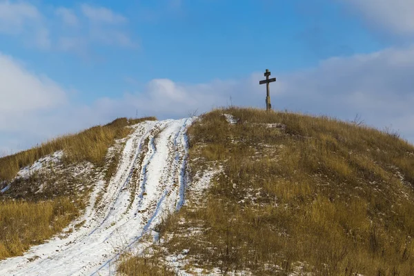 Road leading to the cross on hill