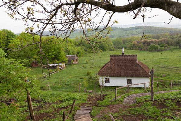 Summer rural landscape. Countryside. View of surroundings of Opishnya village. Beautiful colorful hills covered forest in fog. Ukrainian nature, Poltava region, Ukraine
