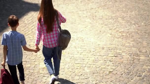 Young Mother Goes Third Grade School Son Walking Holding His — Stock Video