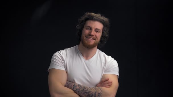 Handsome Muscular Long Haired Guy Stands Isolated Black Background Smiles — Stock Video