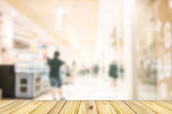 Empty wooden front of abstract blur many people shopping in department store, urban lifestyle concept — Stock Photo, Image
