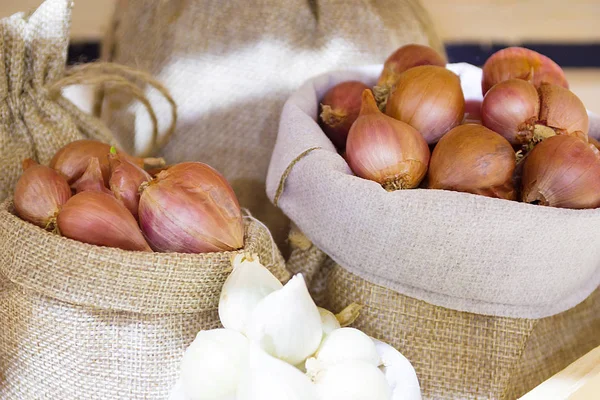 Red Onion In Fabric Bag, Bulb Onion Is Good For Health.
