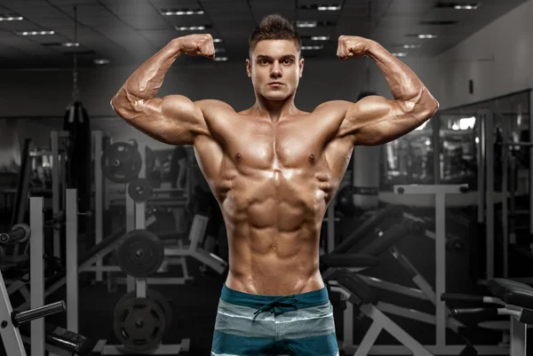 Hombres Deportistas Sexys Con Grandes Músculos Abdominales En Ropa  Deportiva Negra Trabajando En El Gimnasio. Imagen de archivo - Imagen de  atlético, adulto: 202506129