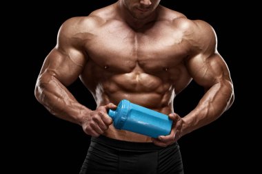 Muscular man with shaker isolated on black. Strong male naked torso abs