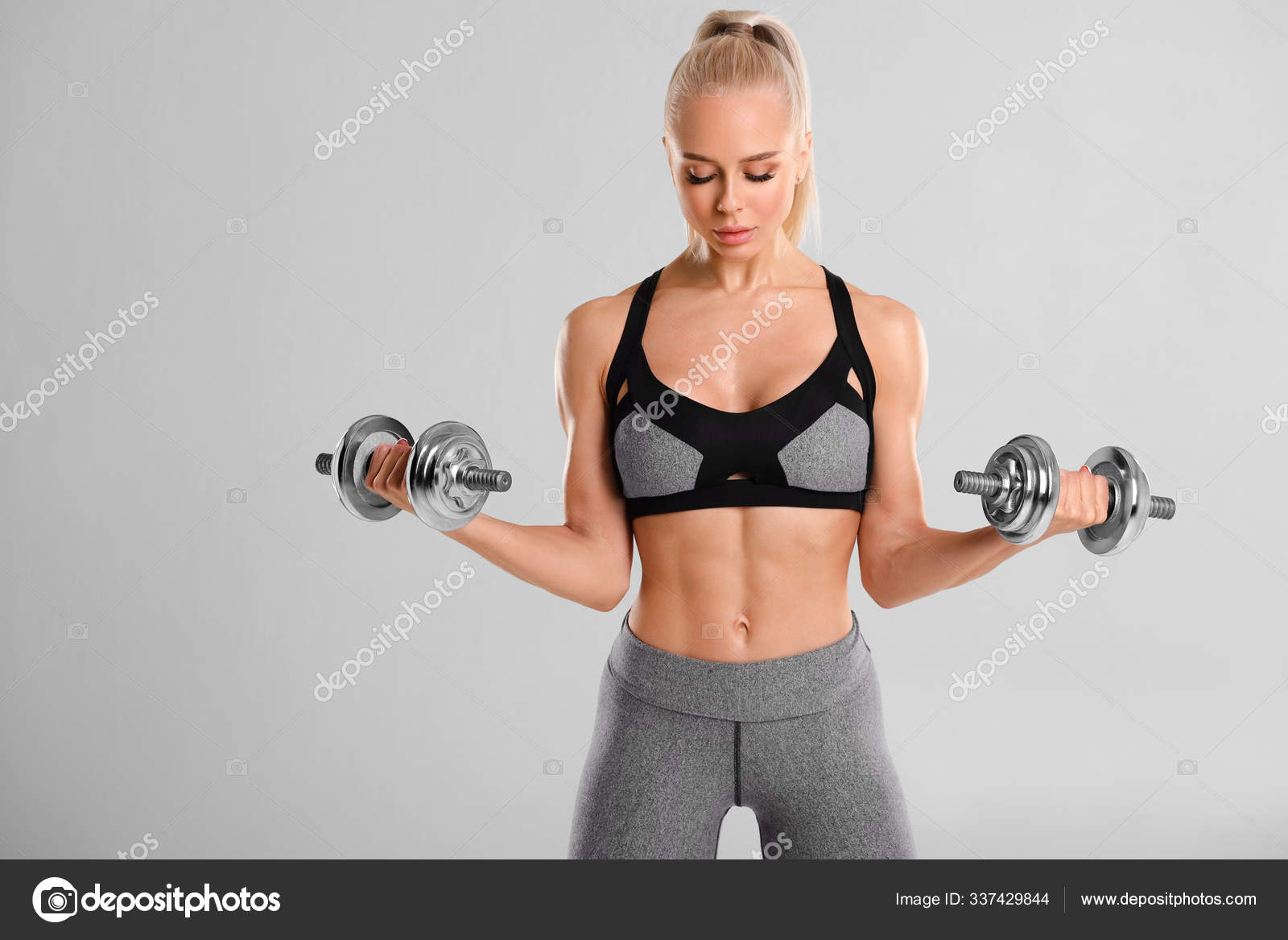 Fitness Woman Working Out in Gym Doing Exercise for Biceps