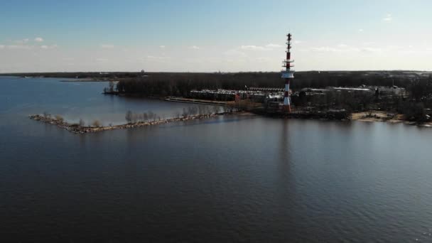 Aerial view on Gulf of Finland coast to modern active acting giant lighthouse — Stock Video