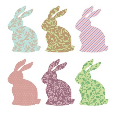 Farklı desenli beyaz bir arka plan üzerinde izole Paskalya tavşanımı kümesi