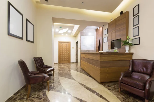 Reception area with wooden reception table Stock Photo