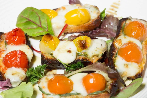 Bruschetta bread with food ingredients served as appetizer — Stock Photo, Image