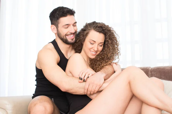 Intimate couple hugging in the bed — Stock Photo, Image