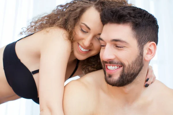 Intimate couple hugging in the bed — Stock Photo, Image