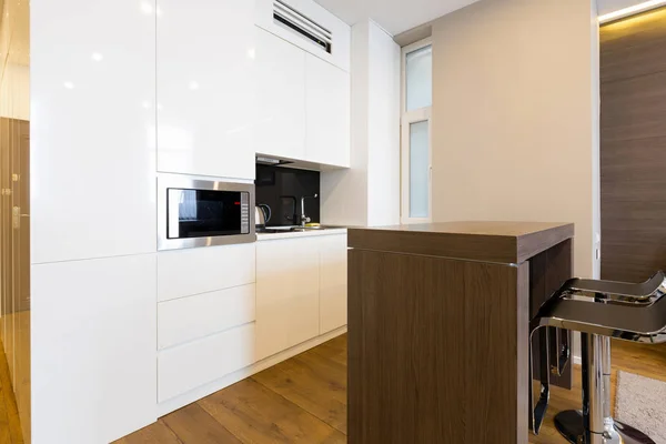 Kitchen area in modern hotel apartment