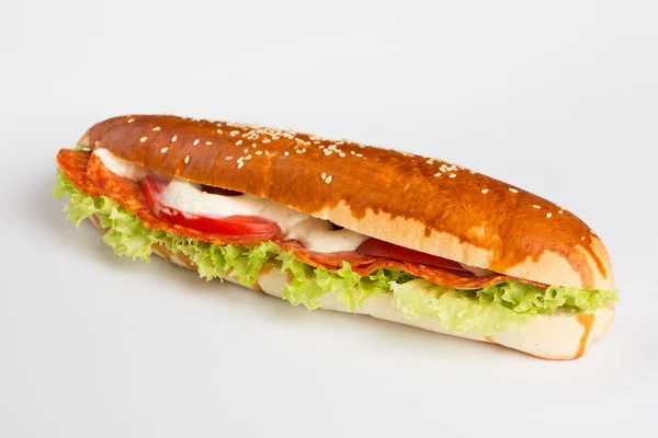 Baguette sandwich with lettuce, tomato and kulen — Stock Photo, Image