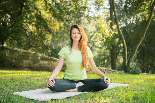 Woman  doing yoga exercise. Easy Pose, Sukhasana