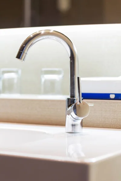 Metal faucet in a kitchen — Stock Photo, Image