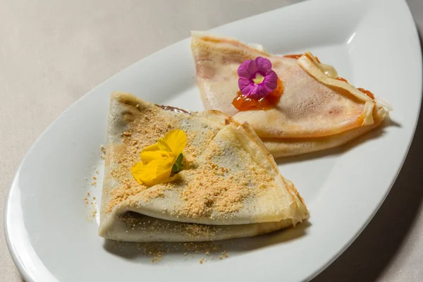 Chocolate and jam pancakes served on white plate — Stockfoto