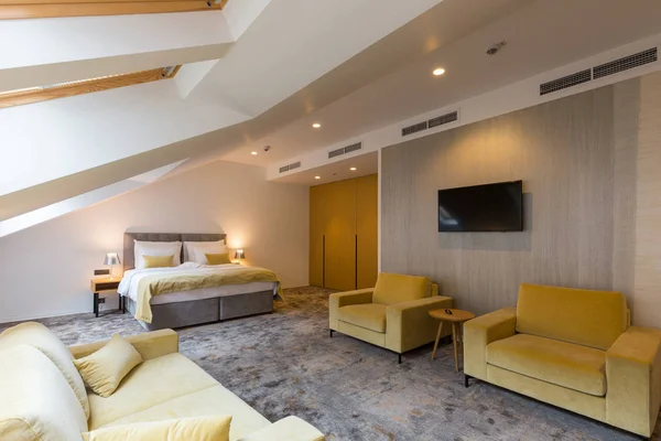 Interior of a loft double bed hotel bedroom — 스톡 사진