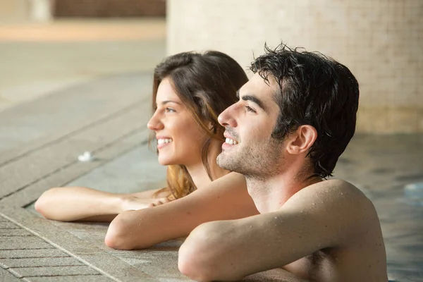 Beautiful Young Couple Relaxing Indoor Swimming Pool — Stock Photo, Image