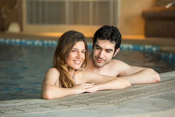 Beautiful Young Couple Relaxing Indoor Swimming Pool — Stock Photo, Image